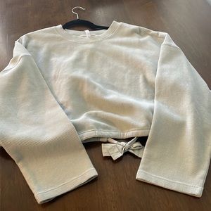 Fabletics open back  green sweater in size medium